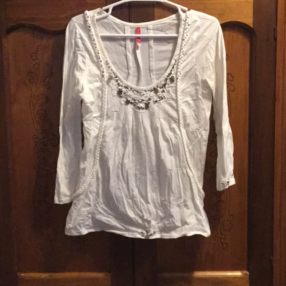 Off white top with lots of details